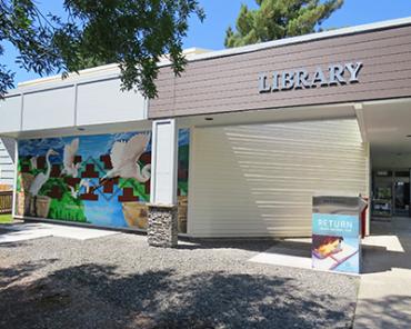 Birds take flight on a mural decorating the wall of Washougal Community Library