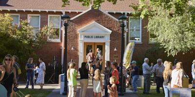 People milling about outside the library doors