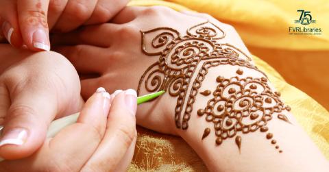 Photo of henna being painted on hand