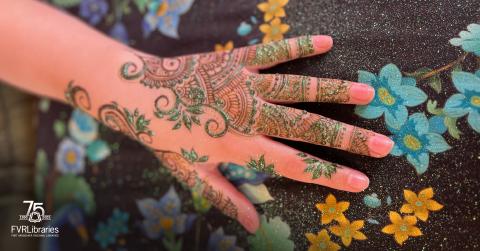 Photo of henna being painted on hand