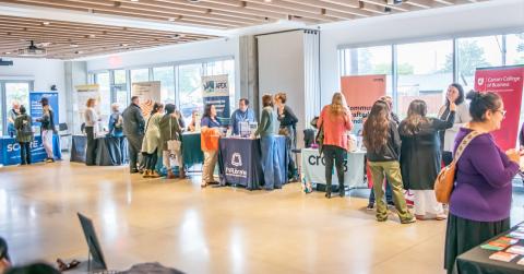 Photo of people visiting representative tables
