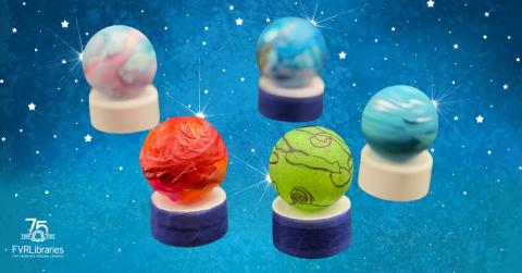 small crafted planets on top of tea light