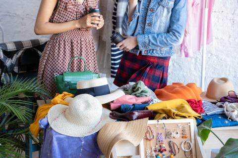 Photo of table with hats and clothes