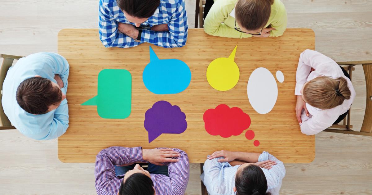 People sitting around a table talking