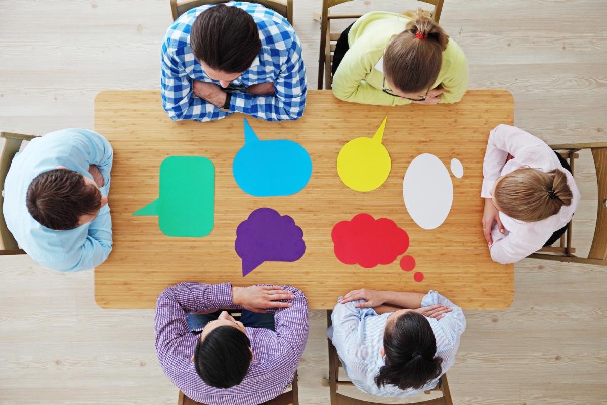 People sitting around a table talking