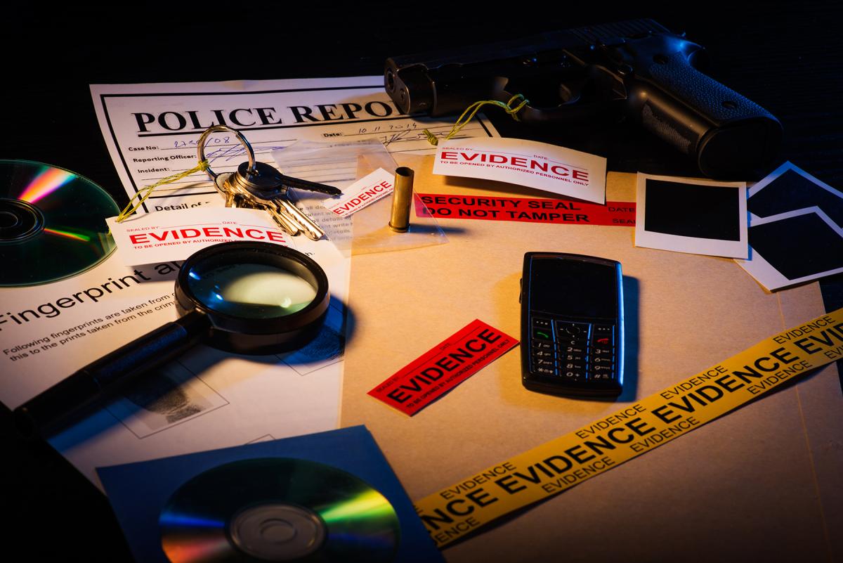 photo of table with magnifying glass and various materials