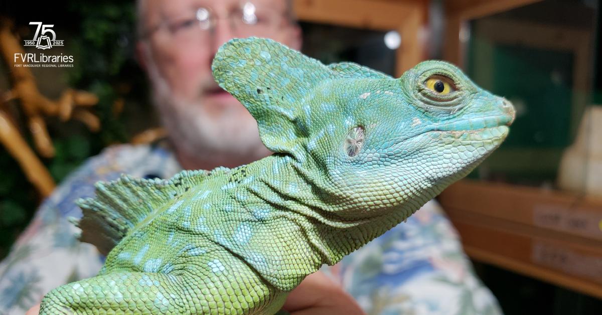 photo of reptile man holding a reptile